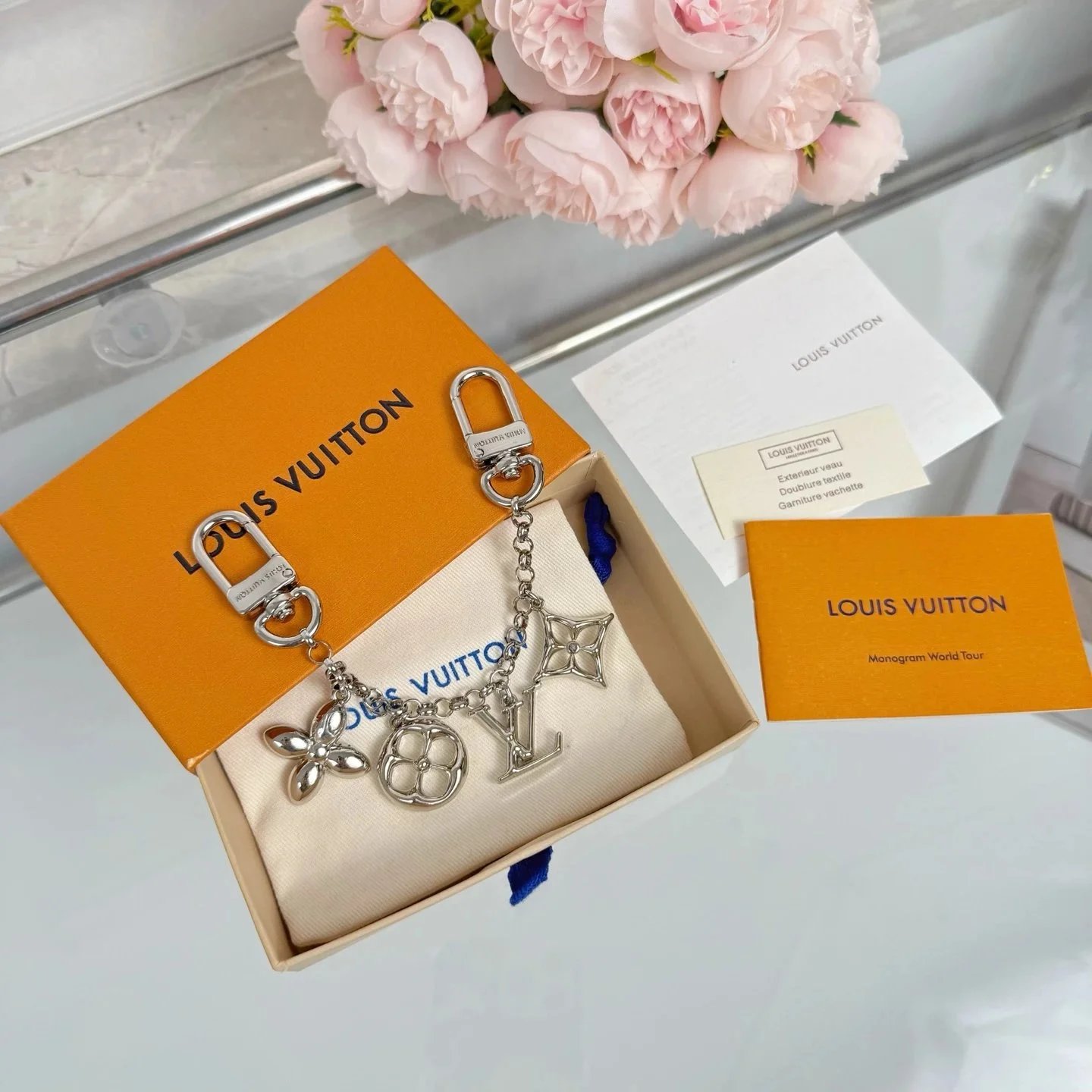 Louis Vuitton Monogram World Tour Charm Keychain Silver